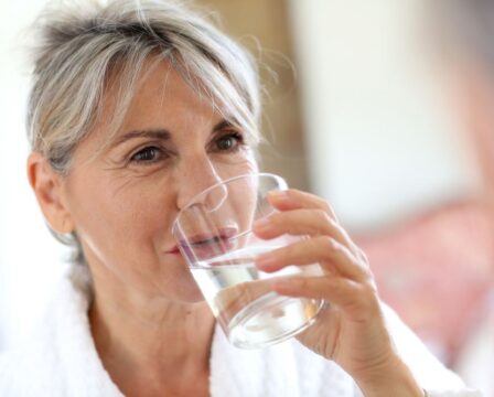 Senior,Woman,Drinking,Water,In,The,Morning