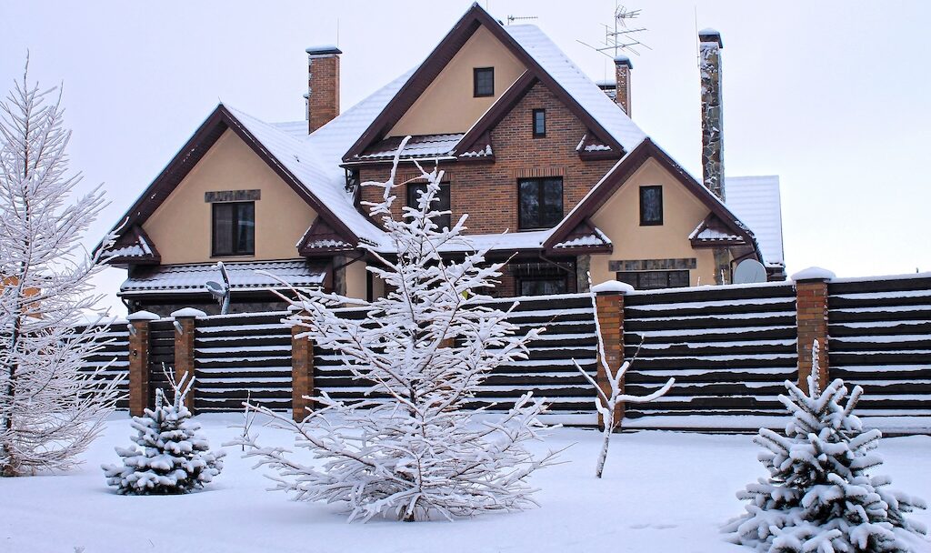 Front of suburban home under snow in winter
