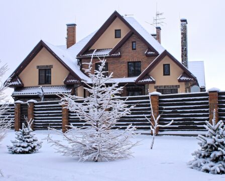 Front of suburban home under snow in winter